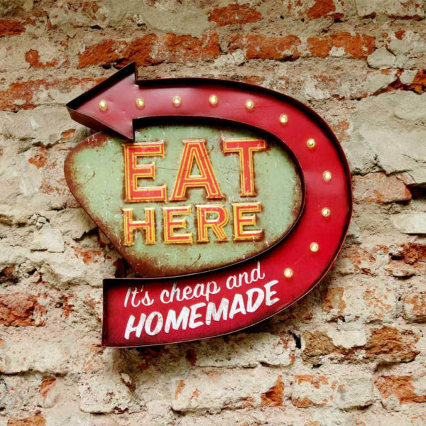 eat here homemade against old brick wall